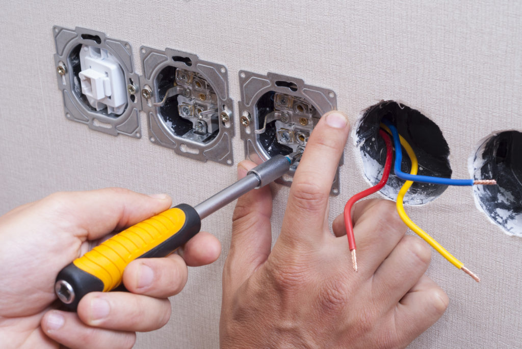 electrician is installing the power outlets